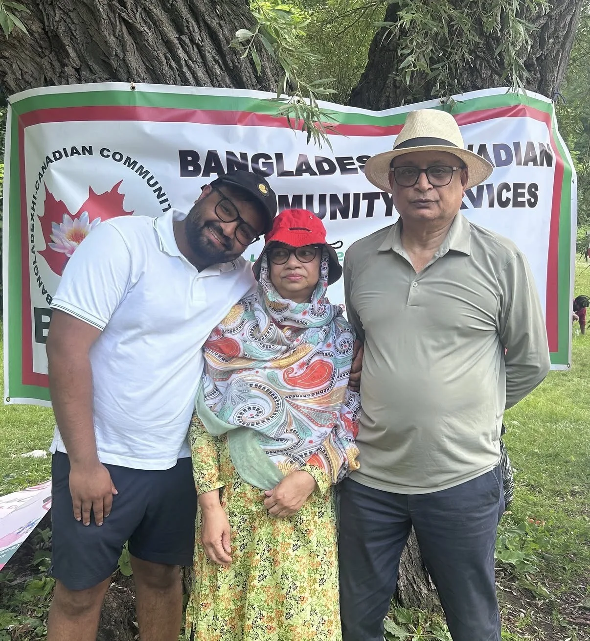 Tanveer Shahnawaz with community members at an outdoor event